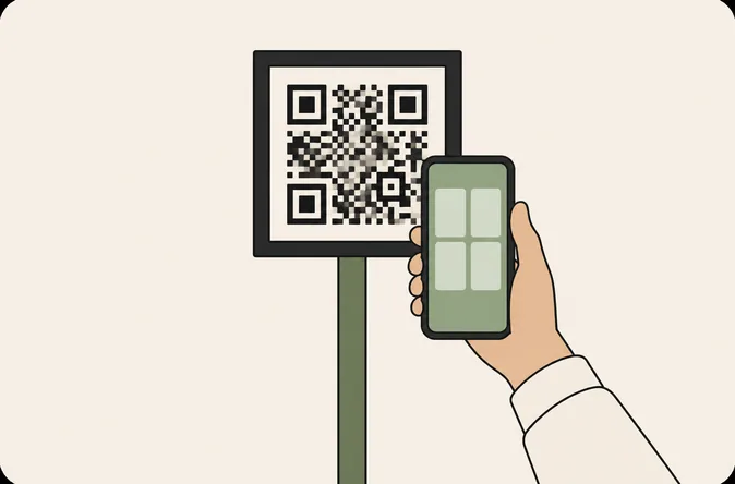 a hand holding a phone up to a QR code on a post